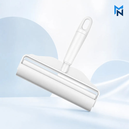White roller brush on a light blue background