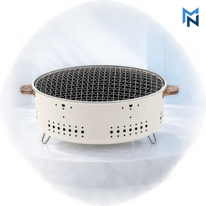 Round outdoor charcoal grill, studio shot