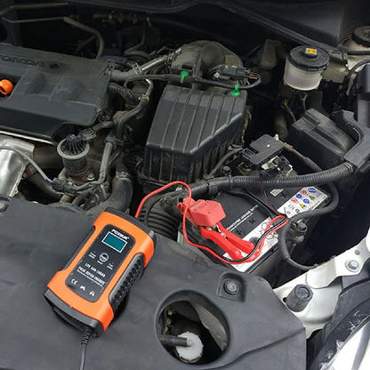 FOXSUR battery charger connected to a car battery